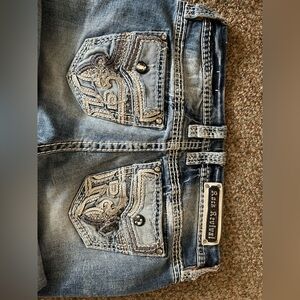 Rock Revival Faded Blue Jeans with Embroidered Pockets
